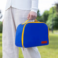 Insulated lunch box bag in sapphire blue with textured cloth exterior and secure closure