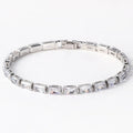 Electroplated zircon bracelet for women with gold tone finish and blue zircon stones