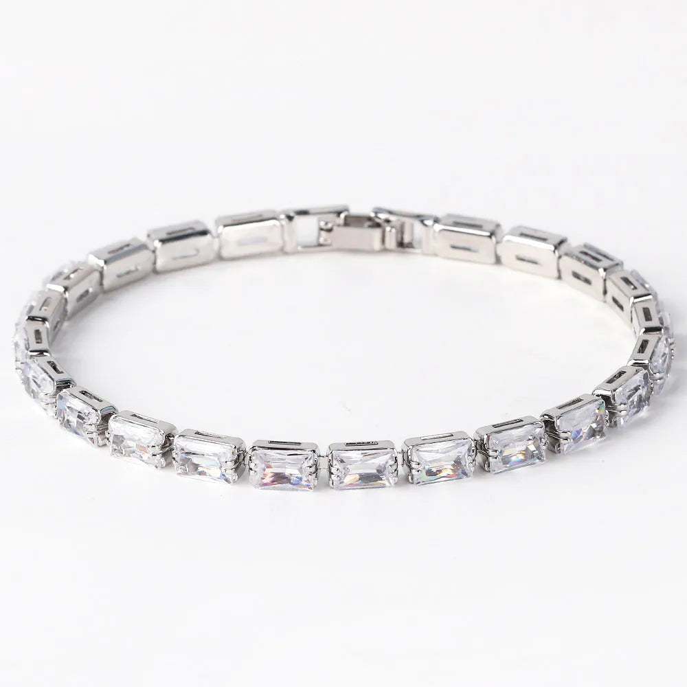 Electroplated zircon bracelet for women with gold tone finish and blue zircon stones