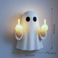 White ghost-shaped night lamp on table with soft glow, measuring 19.85cm tall for Halloween decor