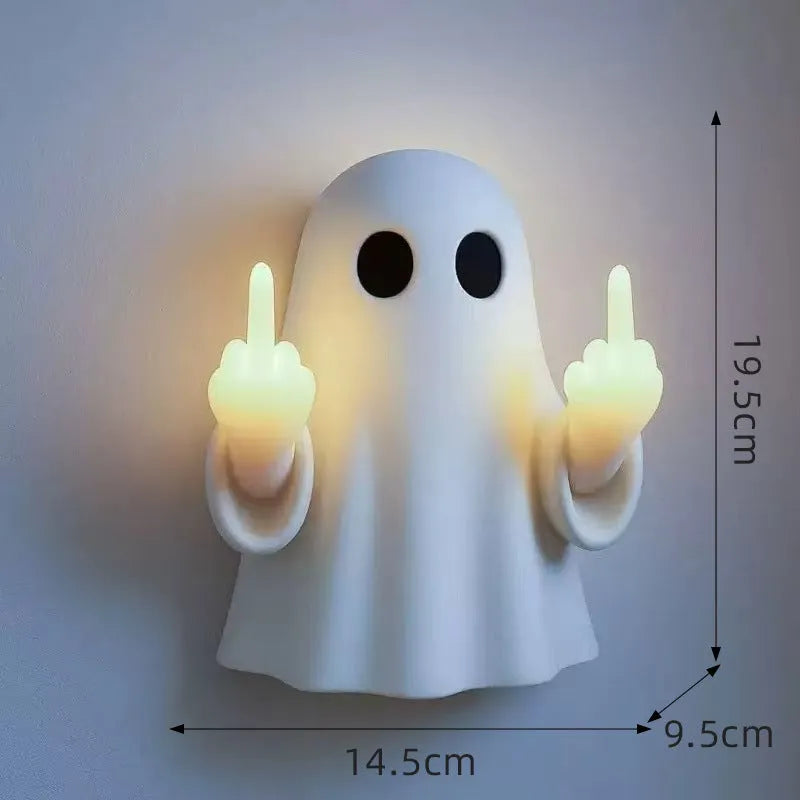 White ghost-shaped night lamp on table with soft glow, measuring 19.85cm tall for Halloween decor