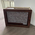 Digital coin bank with nostalgic retro wood design in modern simplicity style, showing currency library options for gifting