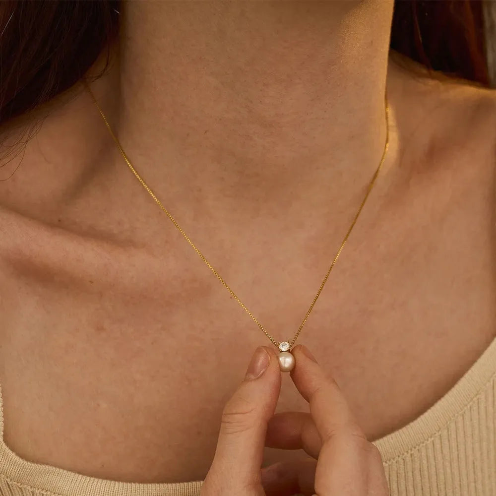 St Delan stainless steel necklace with imitation pearl and zircon pendant in gold and steel colour options