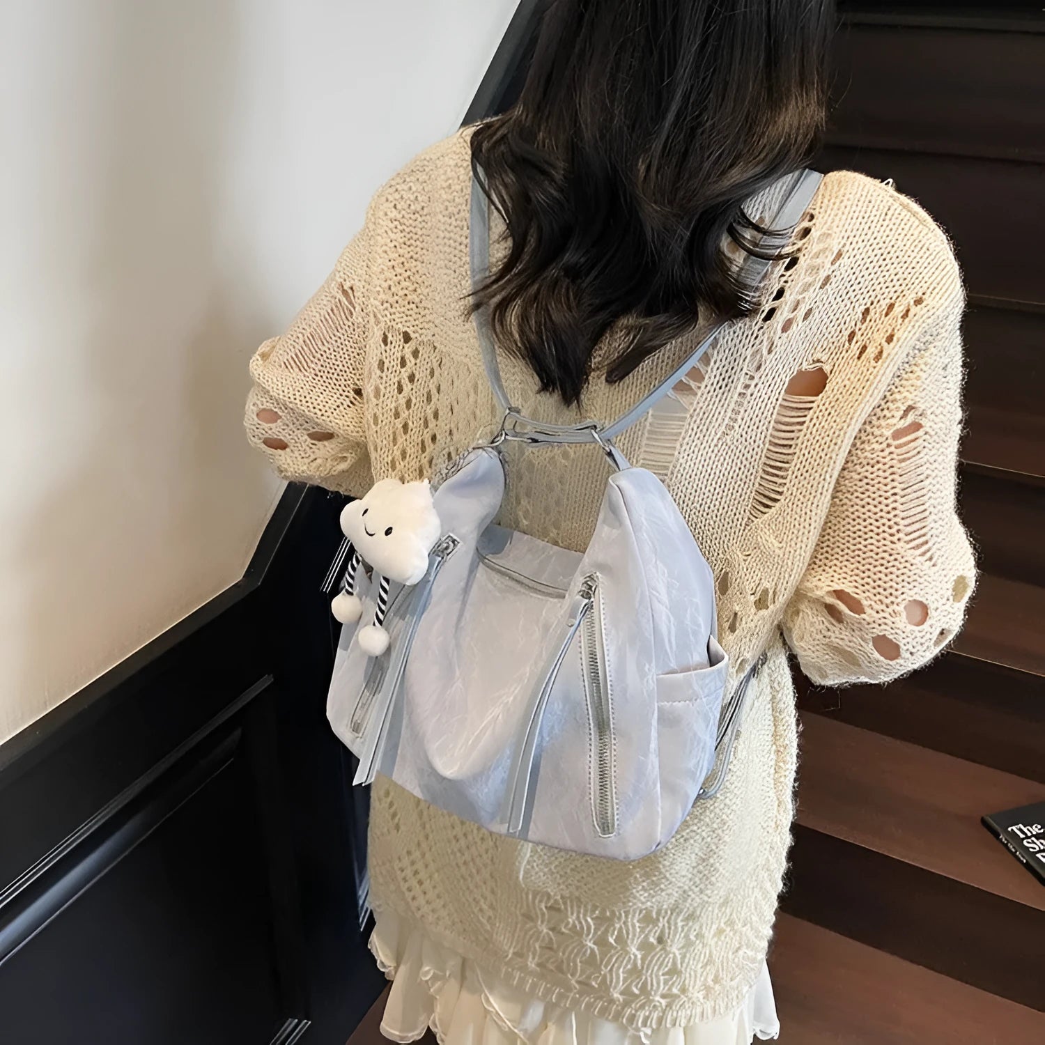 Women's soft PU fashion backpack in four colours with wear-resistant construction and included pendant accessory