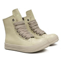 High-top leather sneakers with side zipper in black, showing platform heel and stitching details