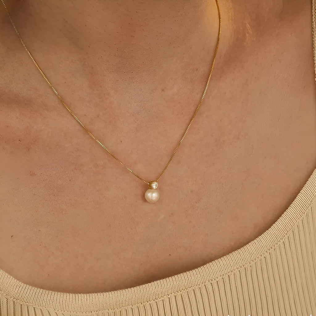 St Delan stainless steel necklace with imitation pearl and zircon pendant in gold and steel colour options