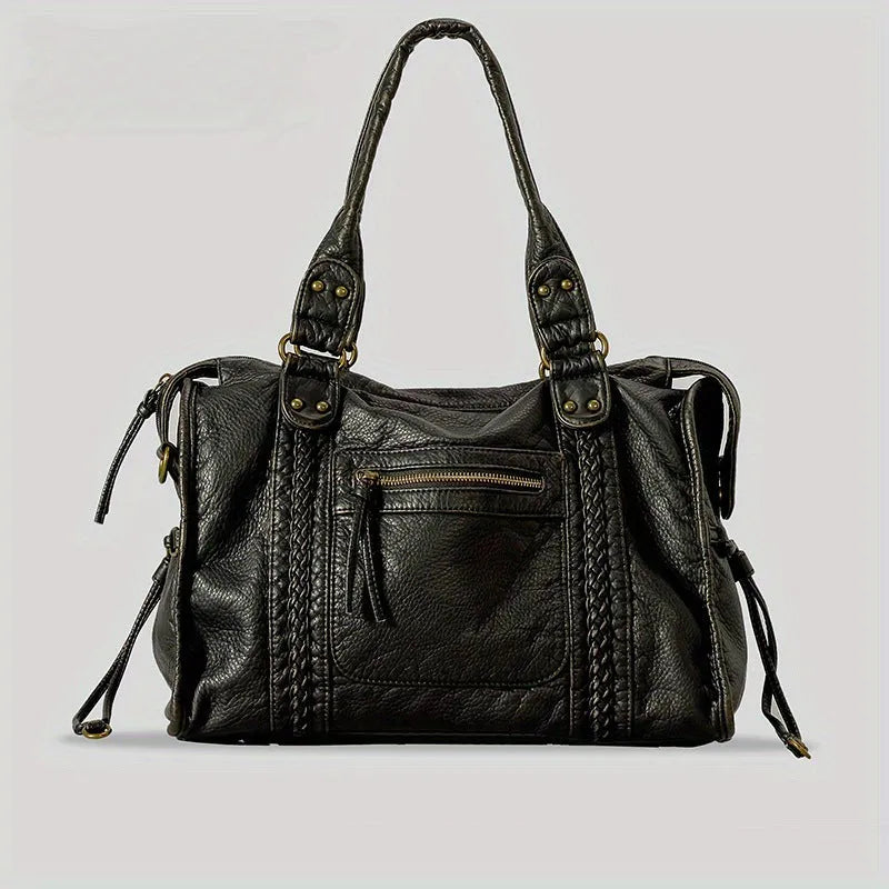 Women's retro messenger bag in bright black with golden edge, showing internal zipper compartments and weaving details