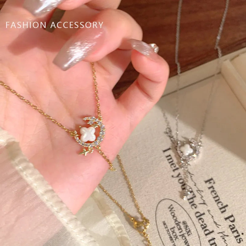 Women's star and moon pendant necklace with zirconium details on adjustable copper clavicle chain