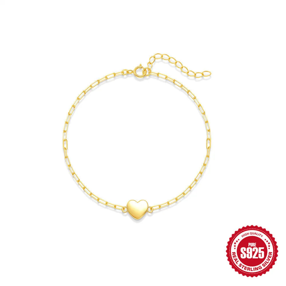 Gold S925 sterling silver women's bracelet with glossy geometric heart and clip chain.