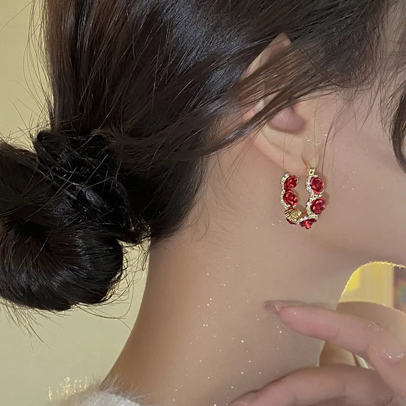 Red floral alloy clip-on earrings with rose detail for women