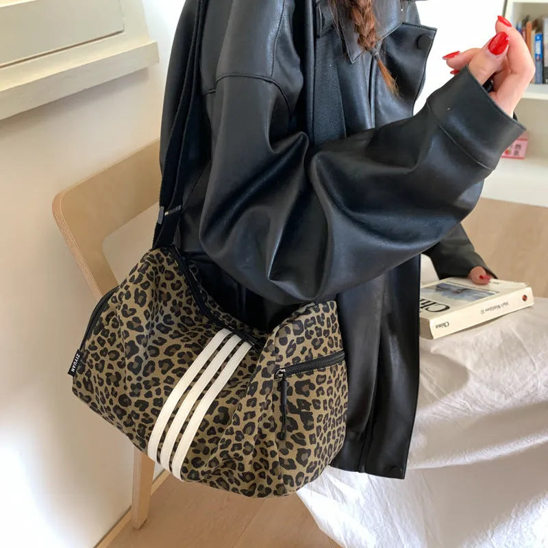 Unisex leopard print messenger bag with striped pattern, crossbody shoulder design