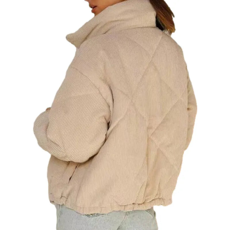 Women's apricot corduroy jacket with stand collar, long sleeves, and zipper closure, showing textured fabric and wadded design.