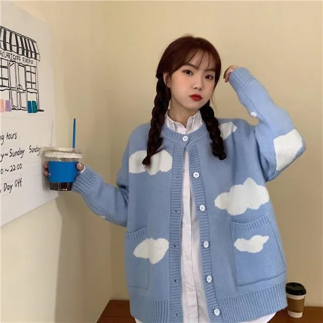 Blue loose-fit women's spandex cardigan sweater with a white cloud pattern.