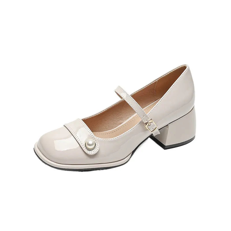 French-style women's chunky heel pumps with buckle fastening, square toe, in patent leather with rubber sole.