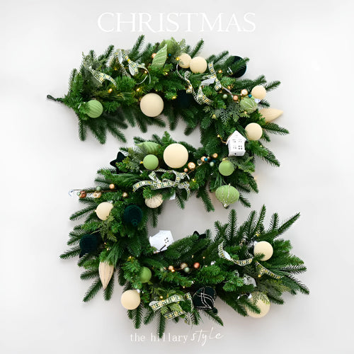 Long artificial rattan Christmas vine with green and white PE leaves and integrated fairy lights.