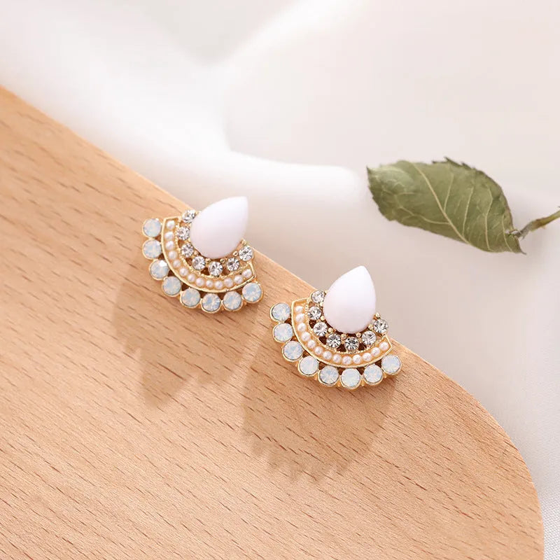 Women's silver geometric fan-shaped earrings with rhinestone and opal detailing on alloy base