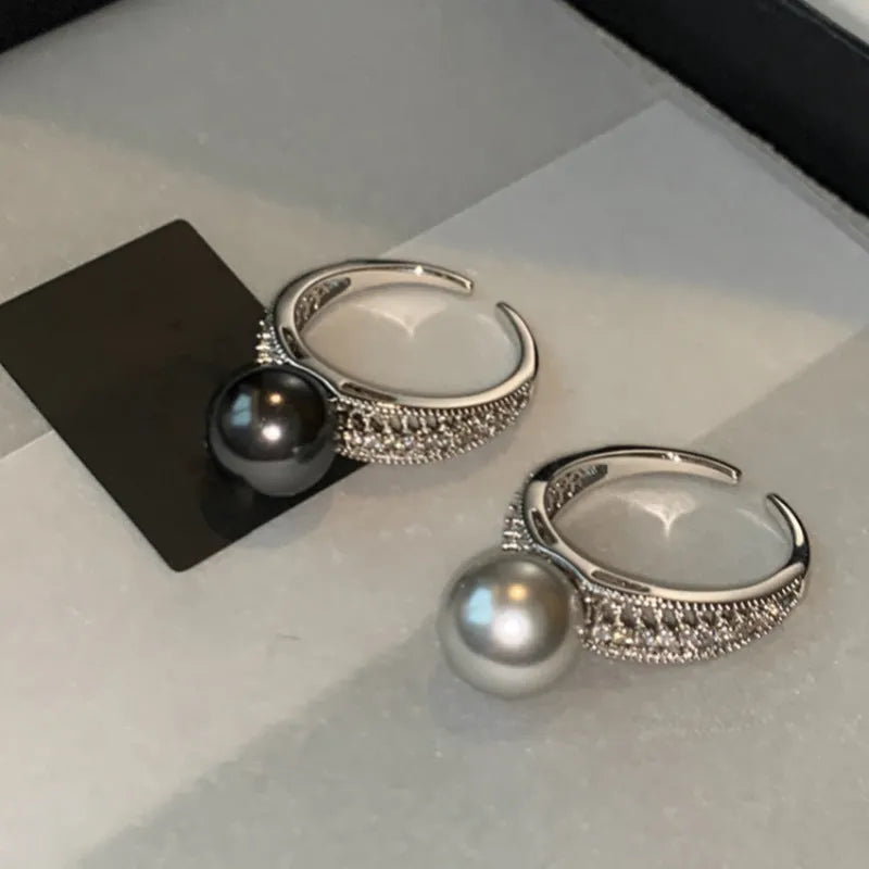 Adjustable geometric copper ring for women with open design showing J5475 colour variation