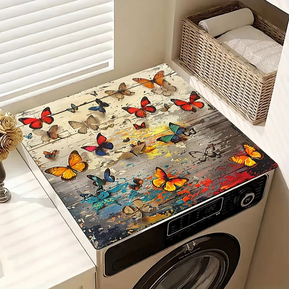 Square polyester washing machine floor mat with an abstract printed design in front of a laundry appliance.