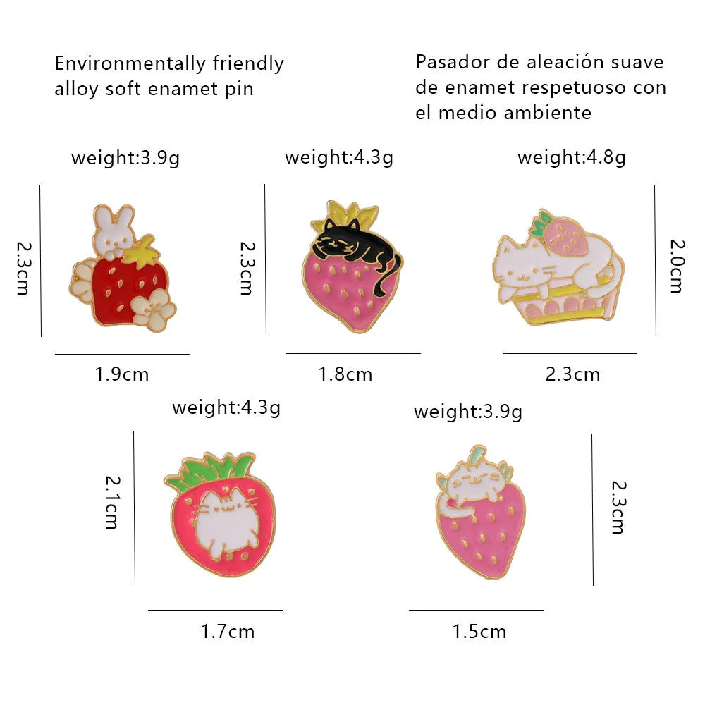 Alloy brooch with a cute cat, strawberry, and dripping oil design in metallic colours.
