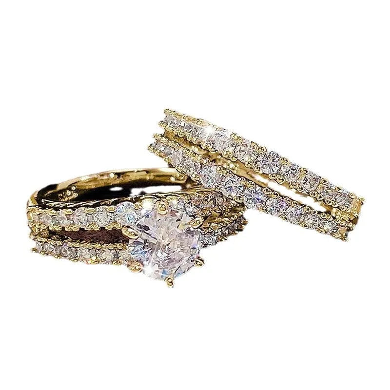 A 2 in 1 female ring set showing a geometric fashion ring and a fully-jewelled ring in gold, rose gold, or silver colour on a UK size 8 finger.