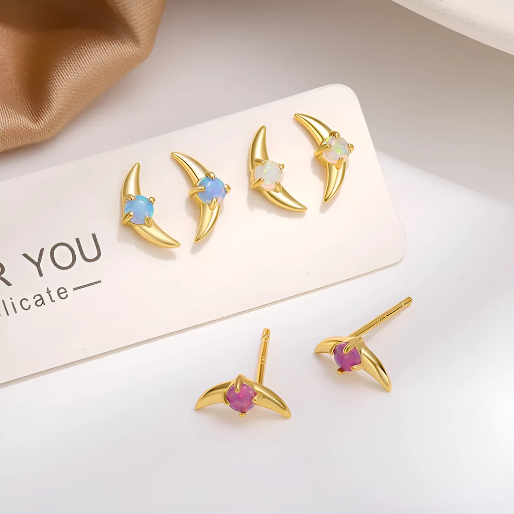 Women's geometric earrings in 925 silver with electroplated finish, showing colour options with blue, purple, and white stones.