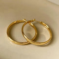 Pair of 40mm diameter circle earrings with electroplated gold or silver finish on copper