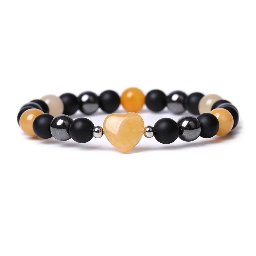Hand-cut geometric peach heart bracelet in Tigereye stone with cosmic moon and planet elements
