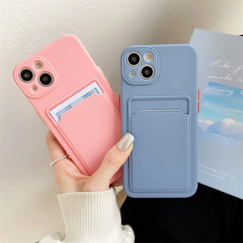 Sky blue silicone iPhone case with a card slot on the back, shown on a mobile phone.