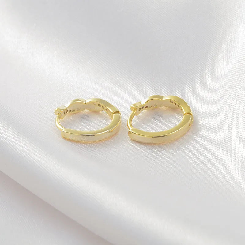 Geometric hemp rope earrings with interwoven design on copper frame, gold plating option shown