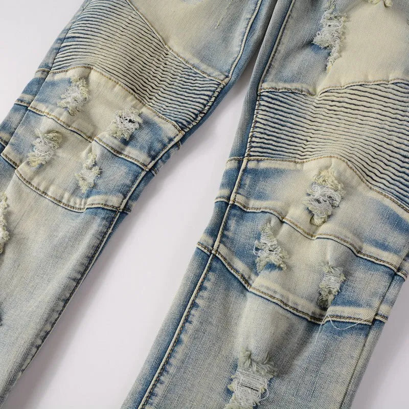 Light blue men's slim fit jeans with hand-frayed distressing on the knees and hem, showing a straight leg cut.