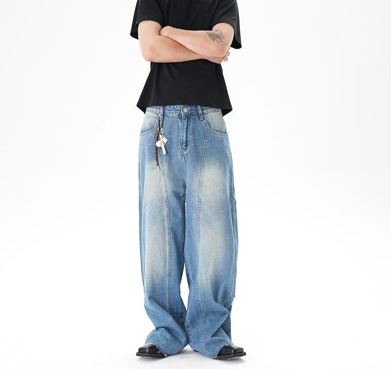 Light blue vintage washed wide leg denim jeans with a zipper fly on a mannequin.