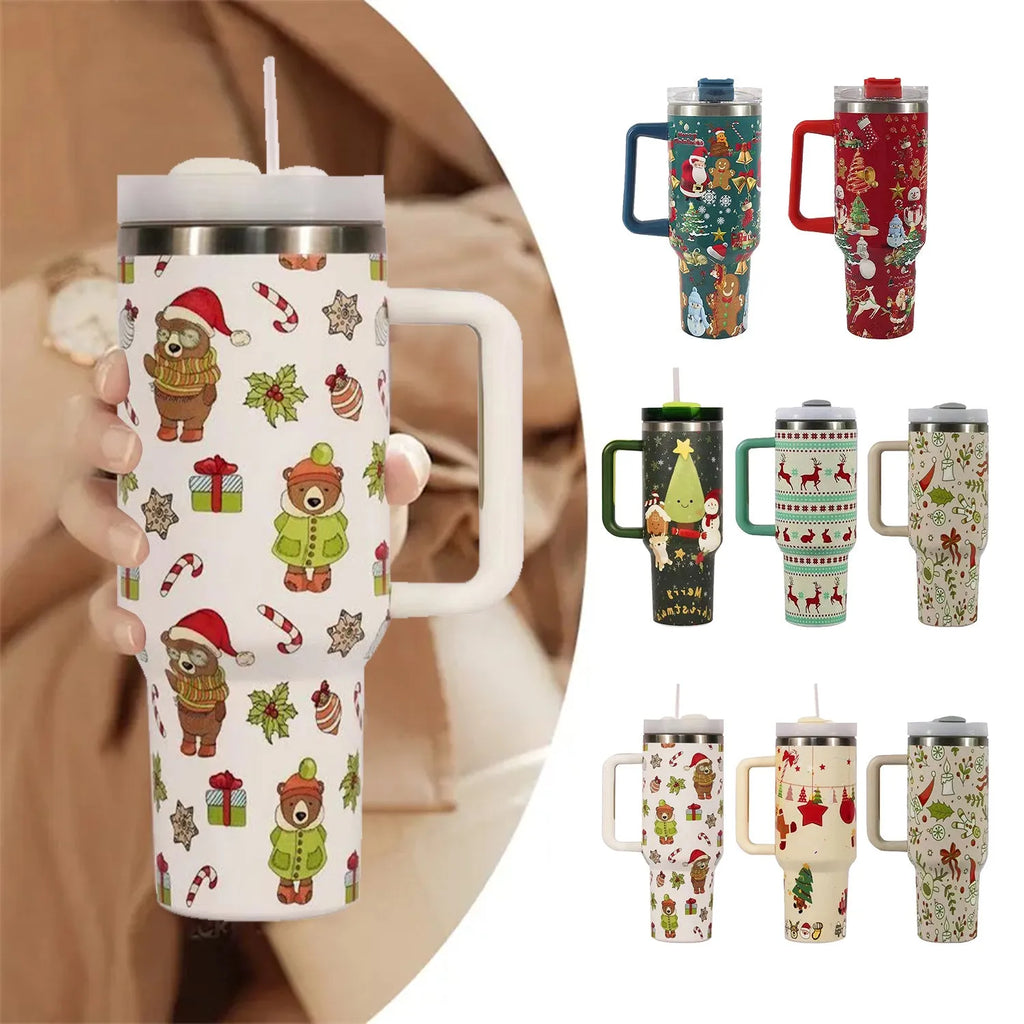 A large stainless steel travel mug with a handle, straw, and Christmas pattern, shown next to its leak-proof lid.