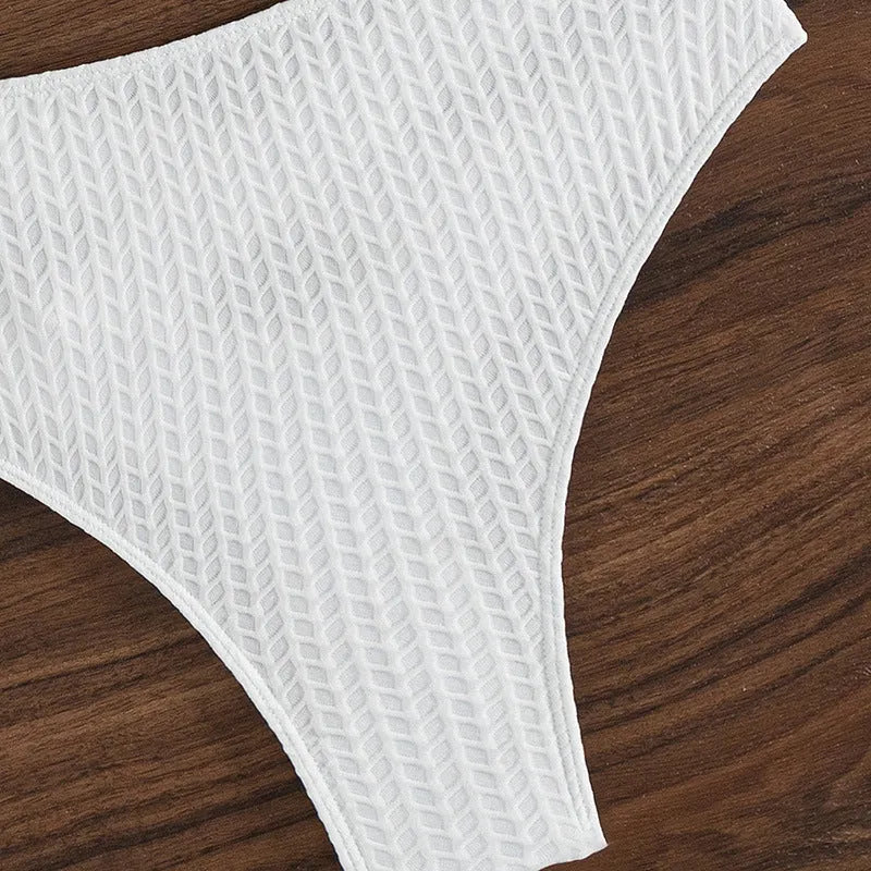 White solid colour backless bikini swimsuit for women on a mannequin