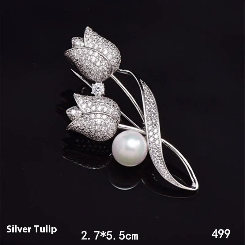 Close-up of a silver tulip coloured flower brooch with micro-inlaid zircon stones on a dark background.