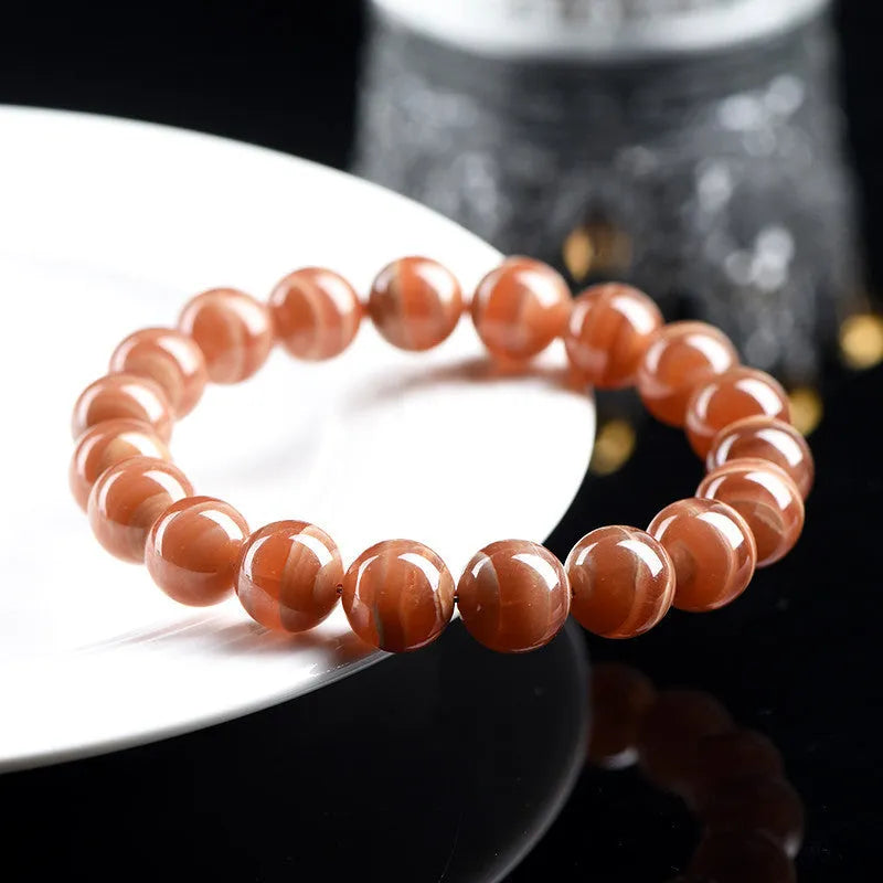 Natural rhodochrosite bracelet with round manganese spar beads and Ruyi decorative elements
