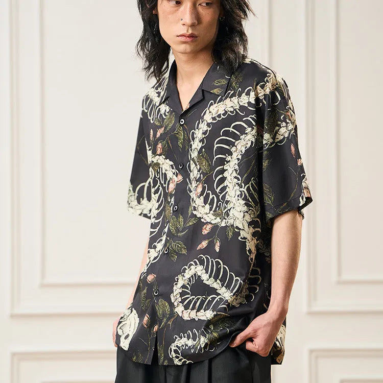 Snake bone floral pattern printed on light blue polyester Cuban collar shirt with short sleeves