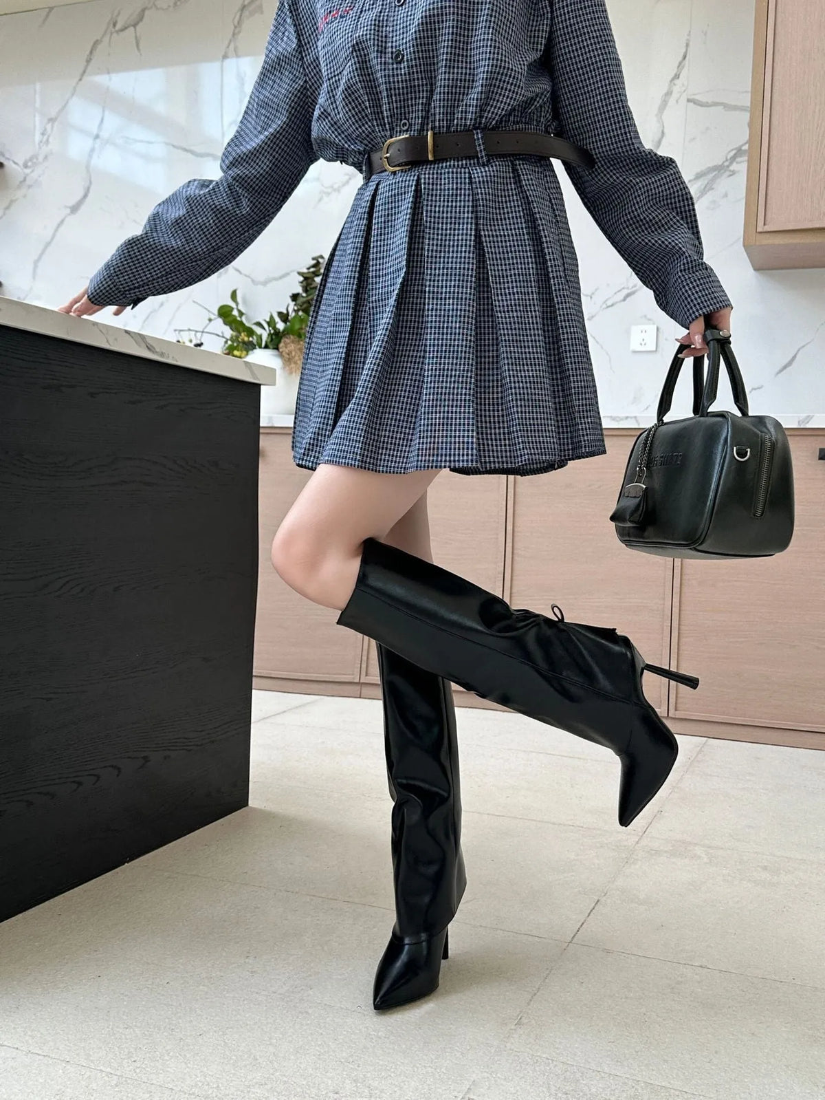 Black artificial PU leg warmer boot covers with stiletto heel, shown as shoe oversleeves.