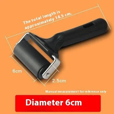 Black rubber paint roller tool with metal bracket, 6cm wide, for wall painting.