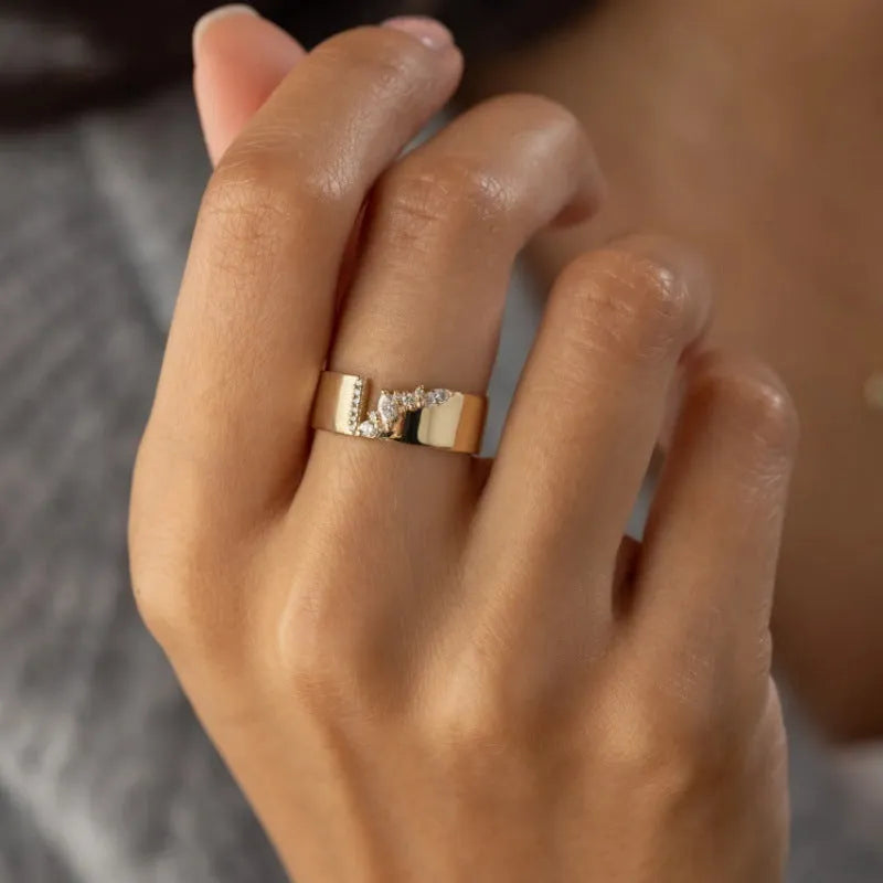 Women's gold electroplated copper ring with zircon stone, showing side and top views