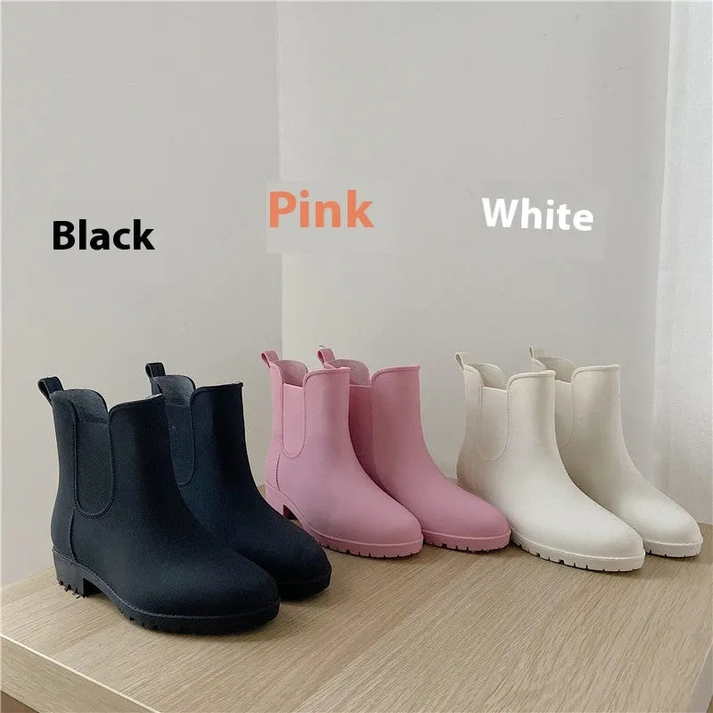 Pair of short rain boots in pink, milky white, or black with non-slip sole and mid-calf length
