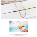 Women's heart-shaped pink crystal pendant necklace on rose gold cross chain