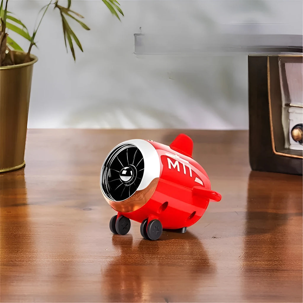 Small portable Bluetooth wireless speaker in vintage blue colour on a table.