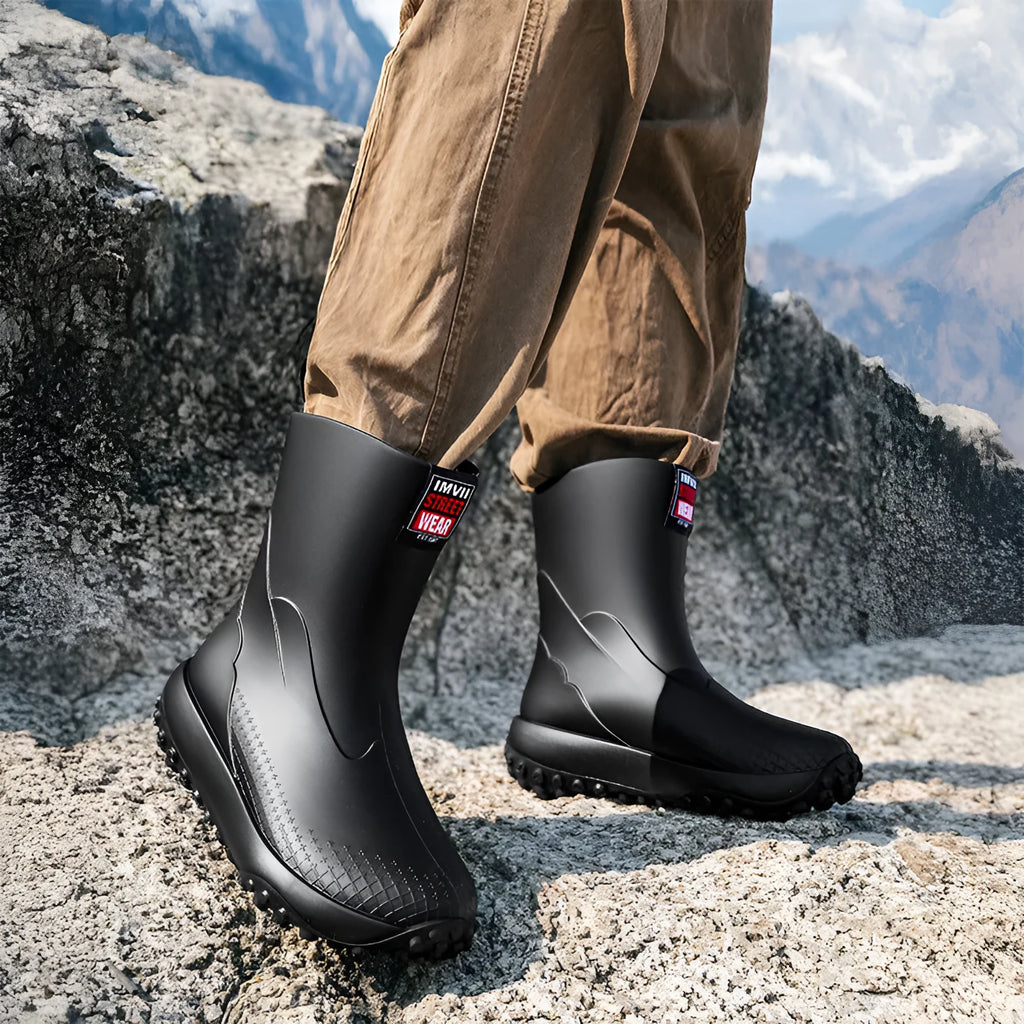 Men's mid-height PVC rain boot in beige with round toe and plastic sole.