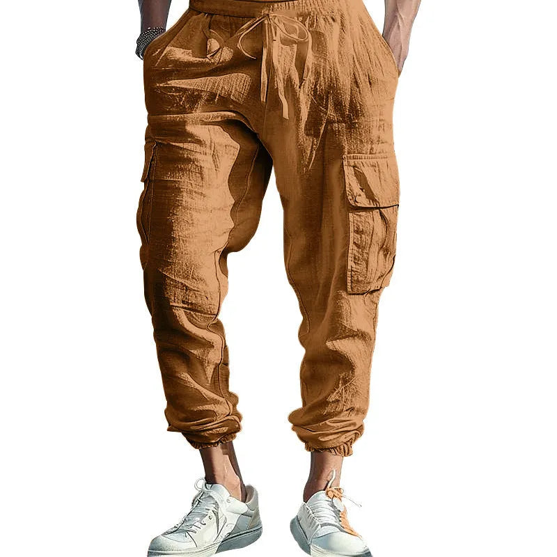 Men's loose-fit linen trousers with ankle ties and multiple pockets in solid colours