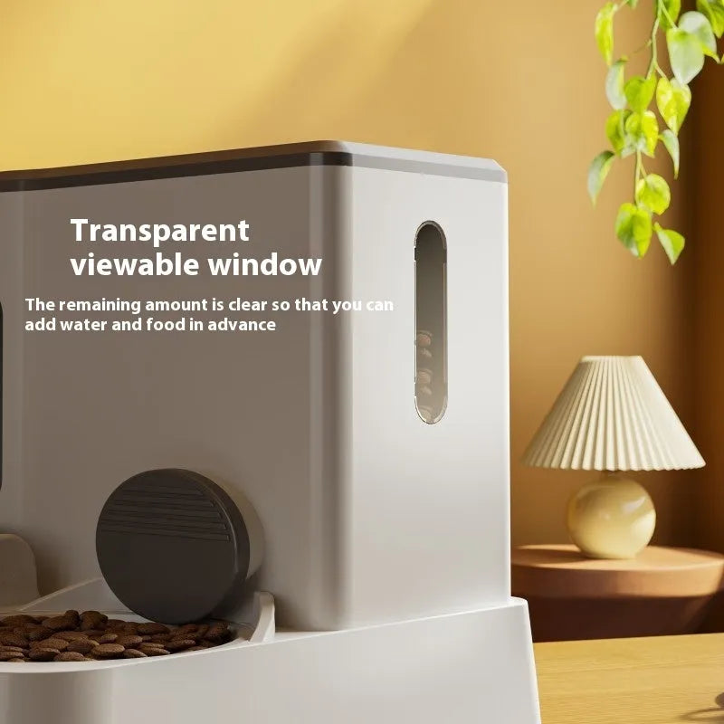 Gray automatic cat feeder with double bowl system showing food and water compartments