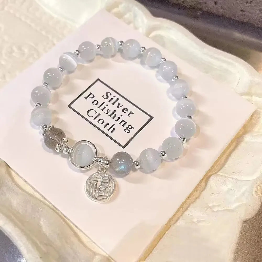 Glass butterfly bracelet for women with drop shape design and round decorative elements in moonlight grey colour