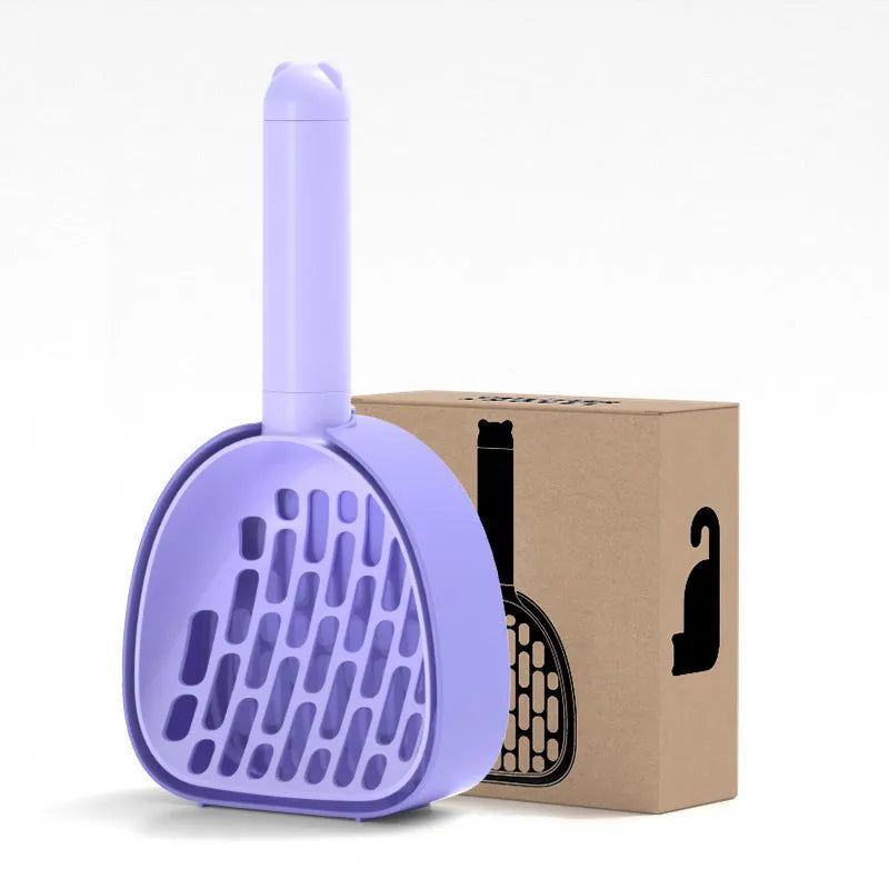 White ABS plastic cat litter scoop standing on a matching storage base with integrated waste bag roll.