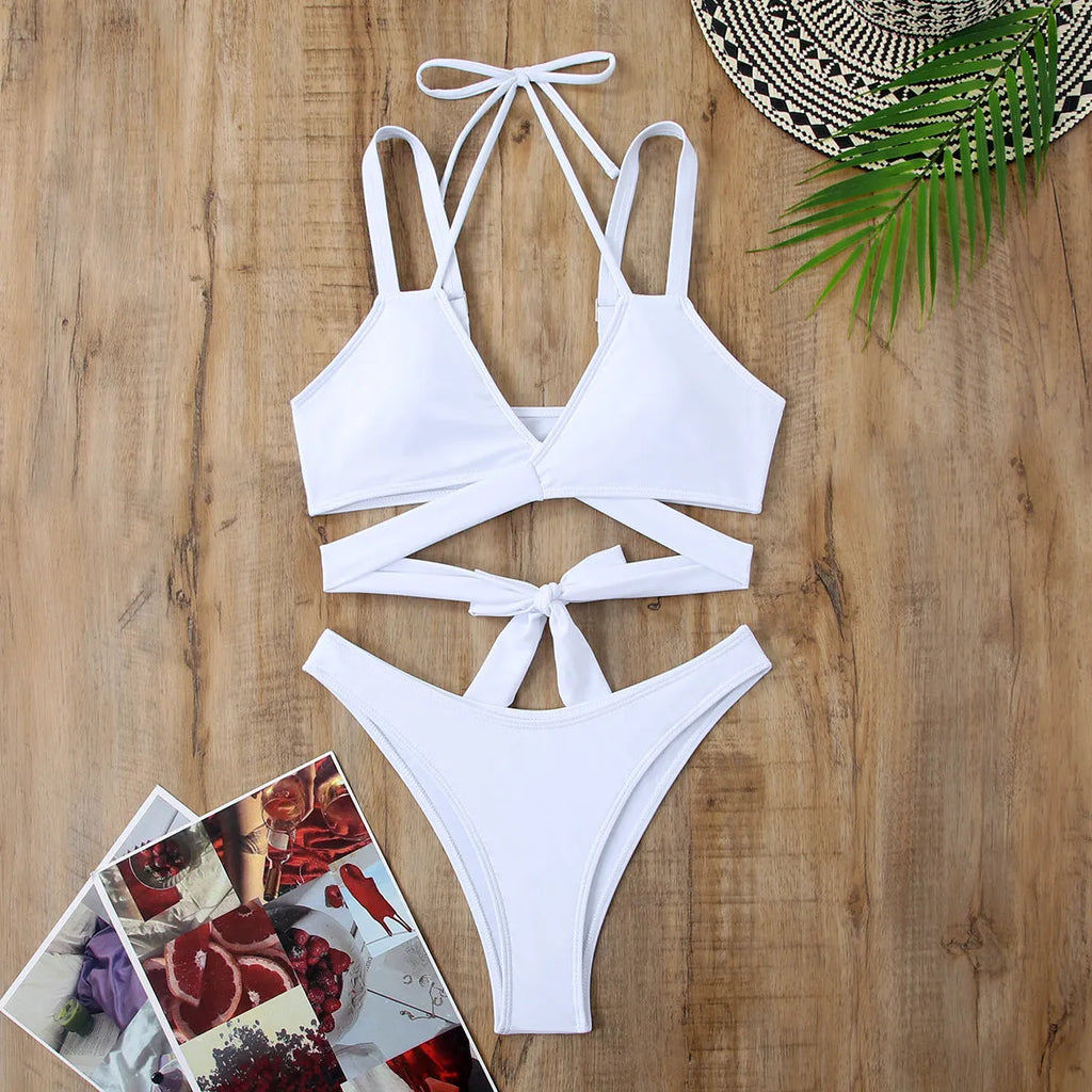Women's solid colour bikini swimsuit with adjustable straps in briefs style, available in multiple colours