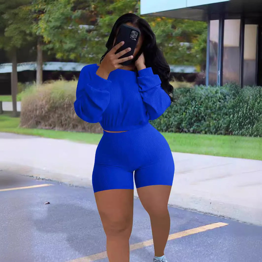 Women's solid colour off-the-shoulder long sleeve top and shorts two-piece set.