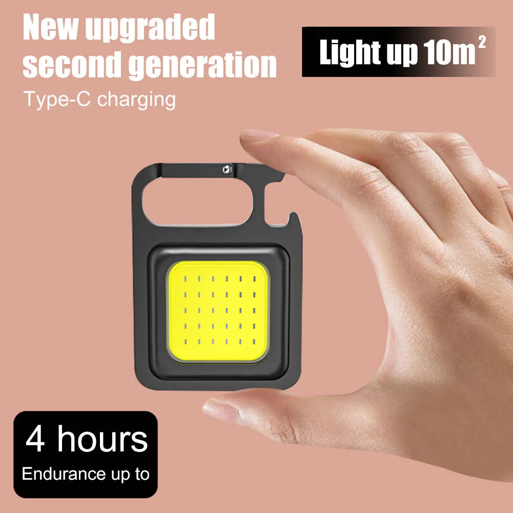 Mini keychain flashlight with COB LED, 400 lumens, USB rechargeable, three modes, hook and bottle opener.